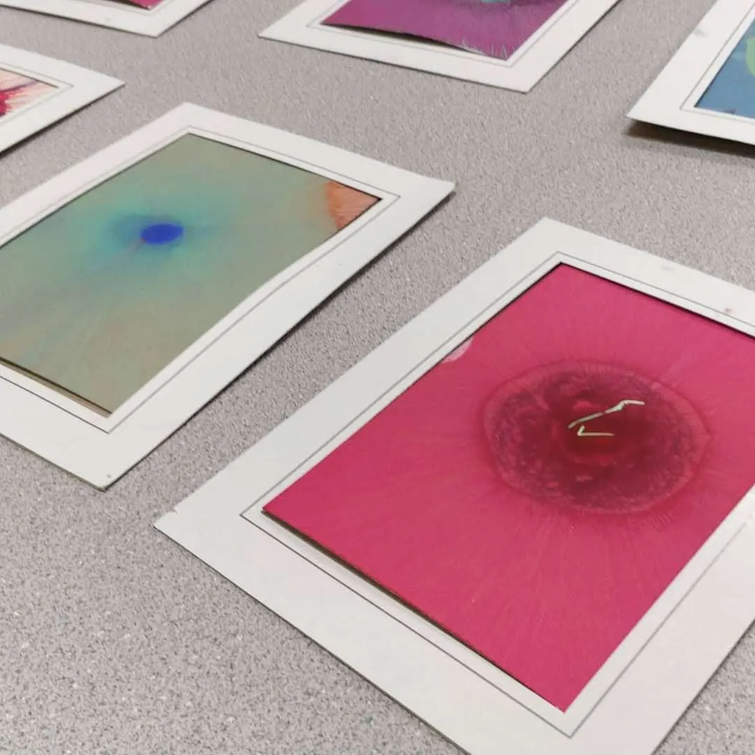 Colorful spin art designs on white cards